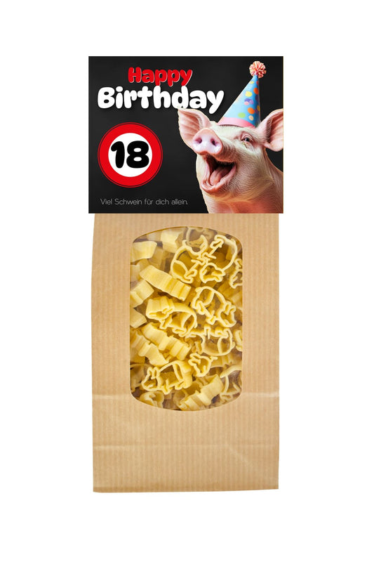 Die Pasta sind in Form von einem Gluecksschweinchen. Auf der Vorderseite steht der Spruch: 18 Happy Birthday. Viel Schwein fuer Dich allein. Geschenk zum 18. Geburi.