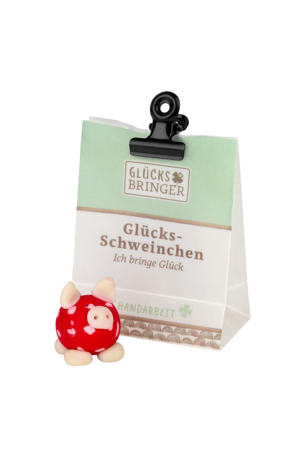 Der Minibeutel verschliesst sich durch eine Klammer. Jeder Gluecksbringer leuchtet im Dunkeln. Gluecksschweinchen: Ich bringe Glueck.