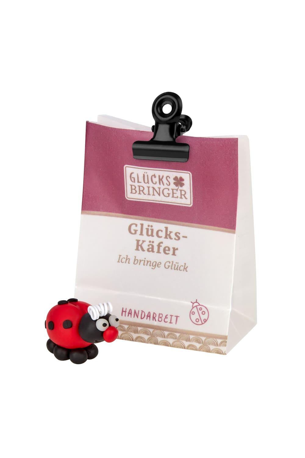 Der Minibeutel verschliesst sich durch eine Klammer. Jeder Gluecksbringer leuchtet im Dunkeln. Glueckskaefer: Ich bringe Glueck.