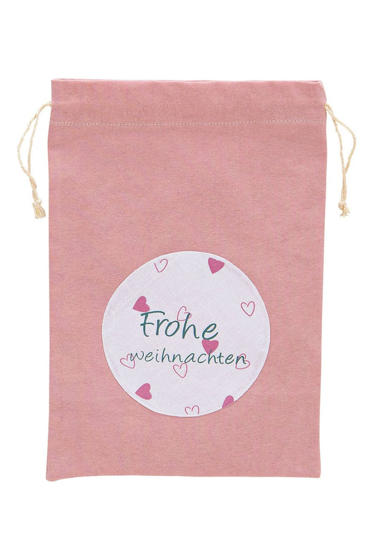 Geschenkverpackung fuer die Weihnachtszeit mit der Aufschrift: Frohe Weihnachten, in der Farbe rosa. Tolles Geschenk zu Weihnachten.