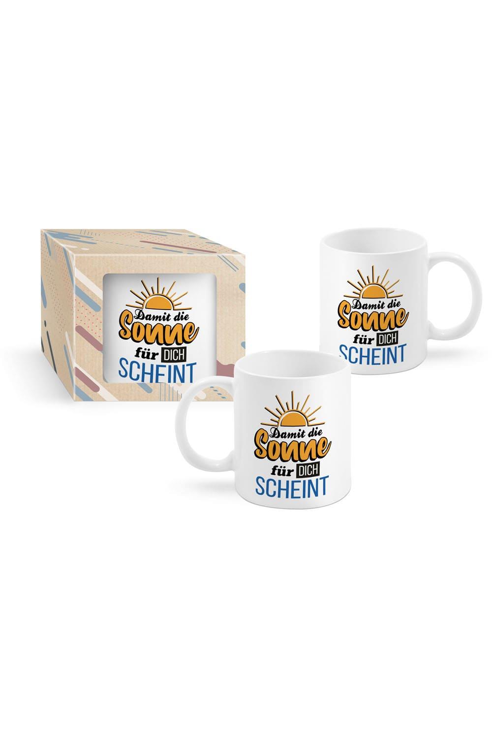 Die Tasse mit der Aufschrift: Damit die Sonne fuer Dich scheint. Die Keramik Spruchtasse ist beidseitig bedruckt und verpackt in einer schoenen Kartonbox. Ein kreatives Geschenk fuer Alle, die gerne Kaffee, Tee oder Ovomaltine trinken.