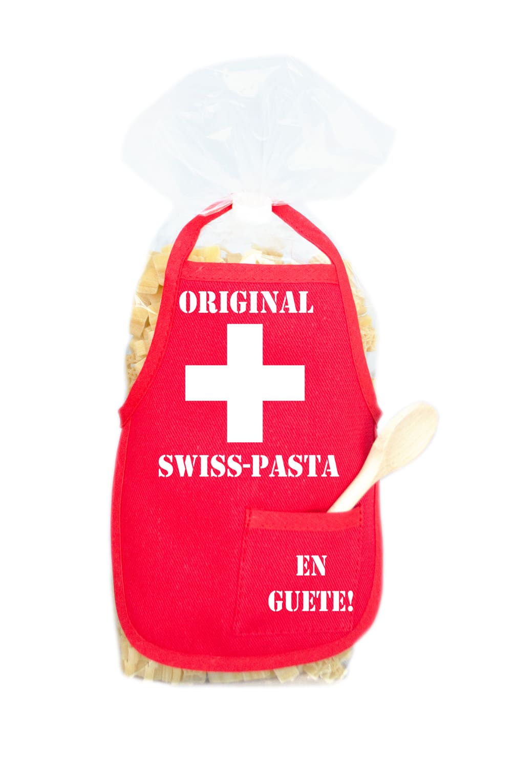 Die Original Swiss Pasta sind in einer schoenen Verpackung mit roter Mini Kochschuerze. Die Schweizerkreuz Motivnudeln sind ein perfektes Geschenk! Auf der Kochschuerze ist ein weisses Schweizerkreuz abgebildet.