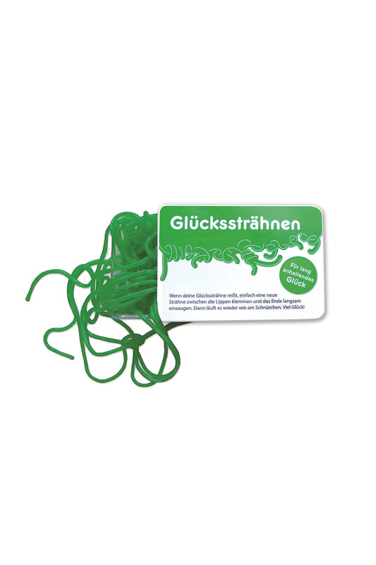 Die leckeren Fruchtgummischnuere mit Apfelgeschmack. Auf der Schiebeschachtel steht der Spruch: Wenn deine Gluecksstraehne reisst, einfach eine neue Straehne zwischen die Lippen klemmen und das Ende langsam einsaugen. Dann laeuft es wieder wie am Schnuerchen. Viel Glueck! Die Gluecksstraehnen sind perfekt als kleines Geschenk.