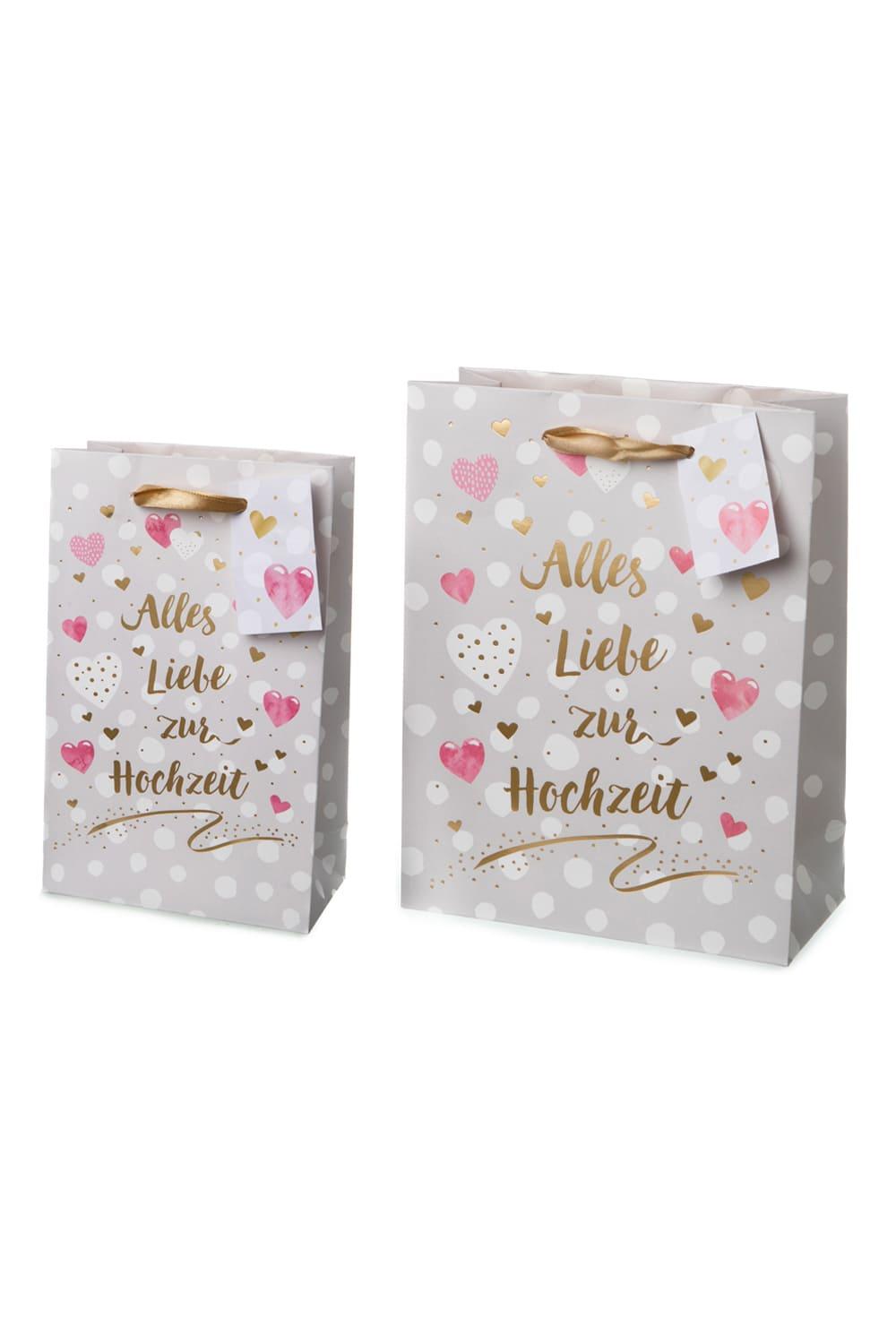 Hochwertige Geschenktaschen mit der Aufschrift: Alles Liebe zur Hochzeit und schoenem Herz Motiv. Die Geschenktueten gibt es in 2 unterschiedlichen Groessen (auswsehlbar). Einfach eine originelle und chice Geschenkverpackung zur Hochzeit. 