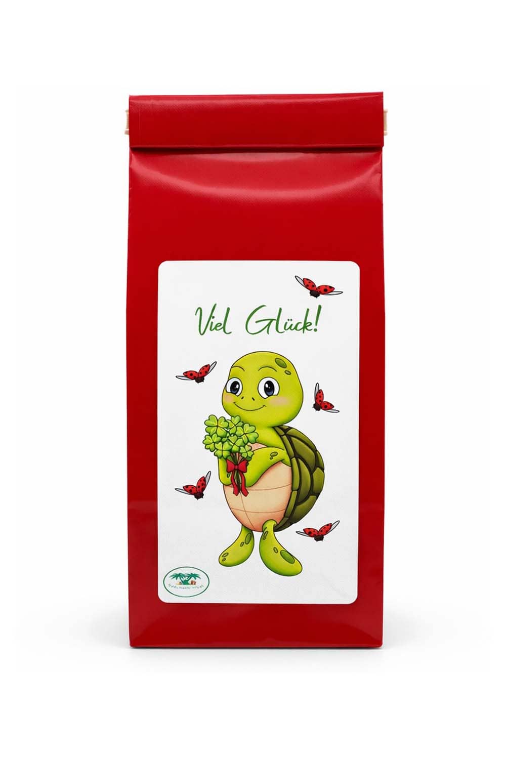 Tee mit der Aufschrift: Viel Glueck, und der niedlichen Schildkroete Lia. Die Schildkroete haelt einen Strauss voller vierblaettrigen Kleeblaettern in der Hand. 
