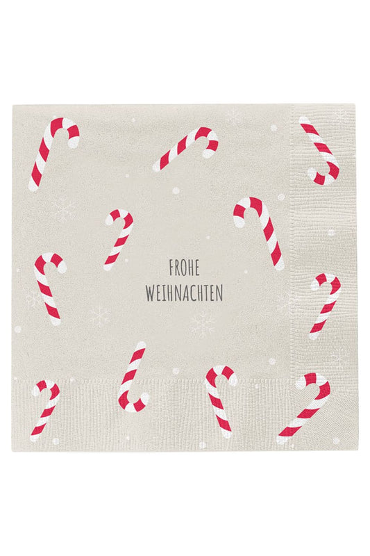 Weihnachtsservietten mit rot-weissen Zuckerstangen als festliche Tischdekoration.